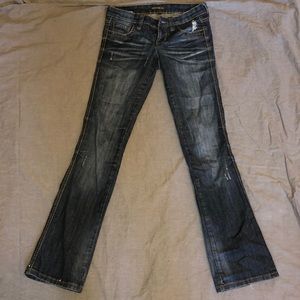Mid rise boot cut distressed jeans